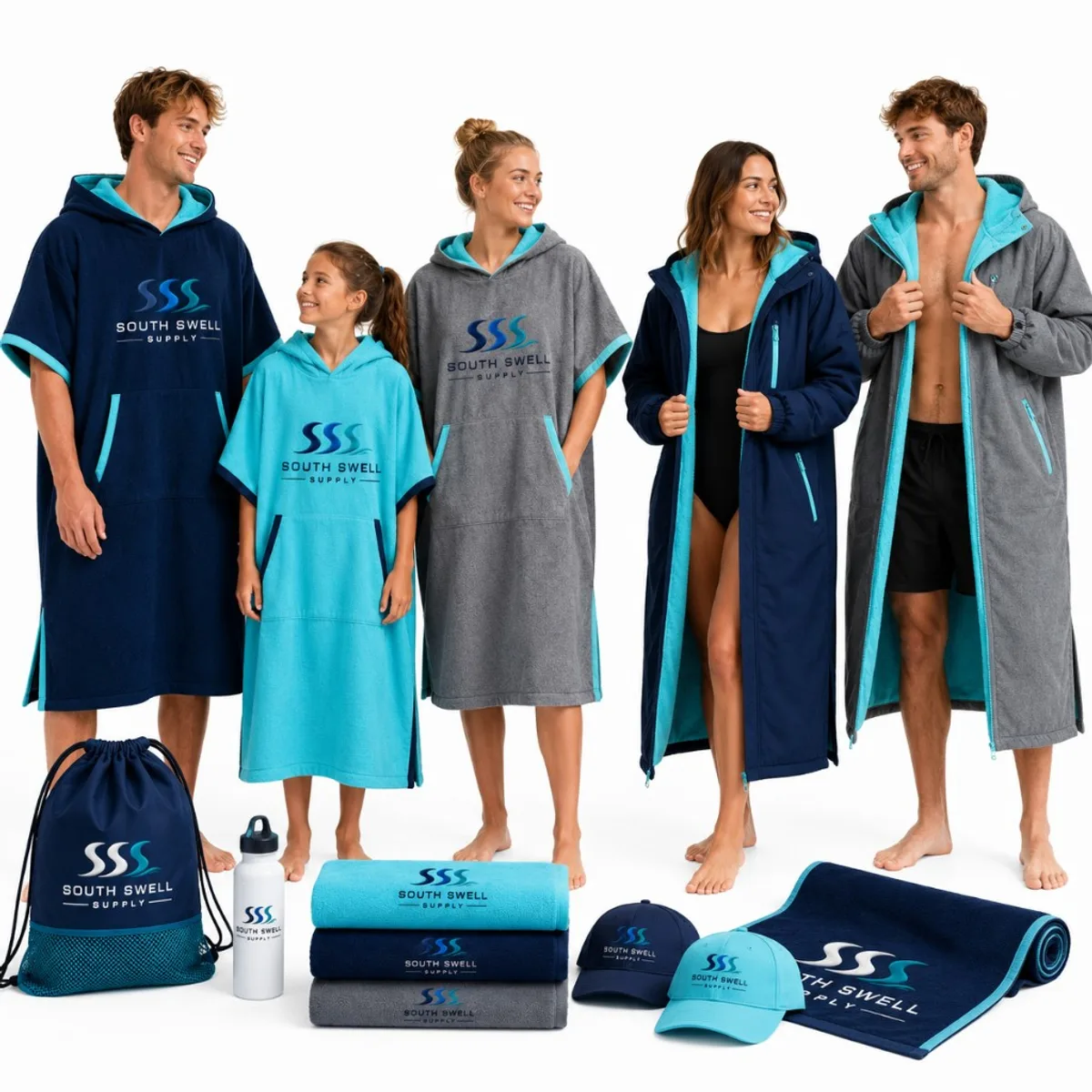 Family and swim squad wearing custom hooded poncho towels and parkas in navy, turquoise and grey with matching club accessories.